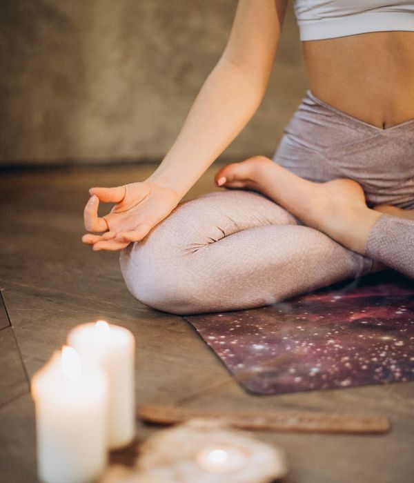 Woman in a calm yoga pose, embodying balance and focus.